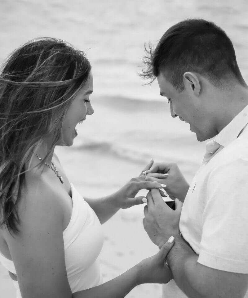 Happy couple during Surprise Proposal Photo session Delnor-Wiggins Pass State Park by Katrina Photography
