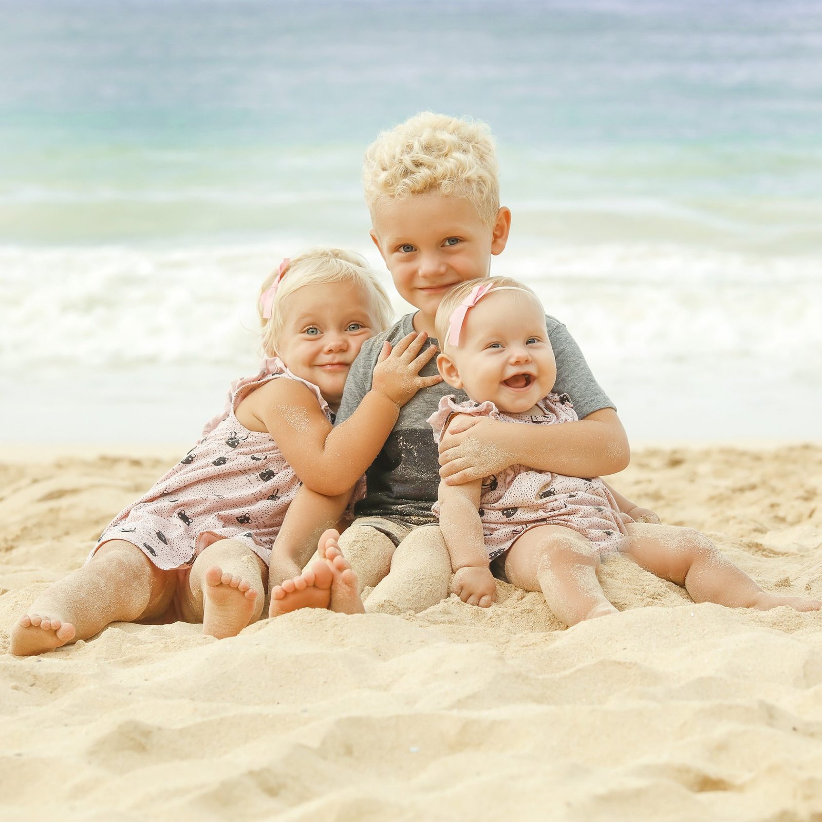 3 Children on the beach in Naples photo by Katrina Photography