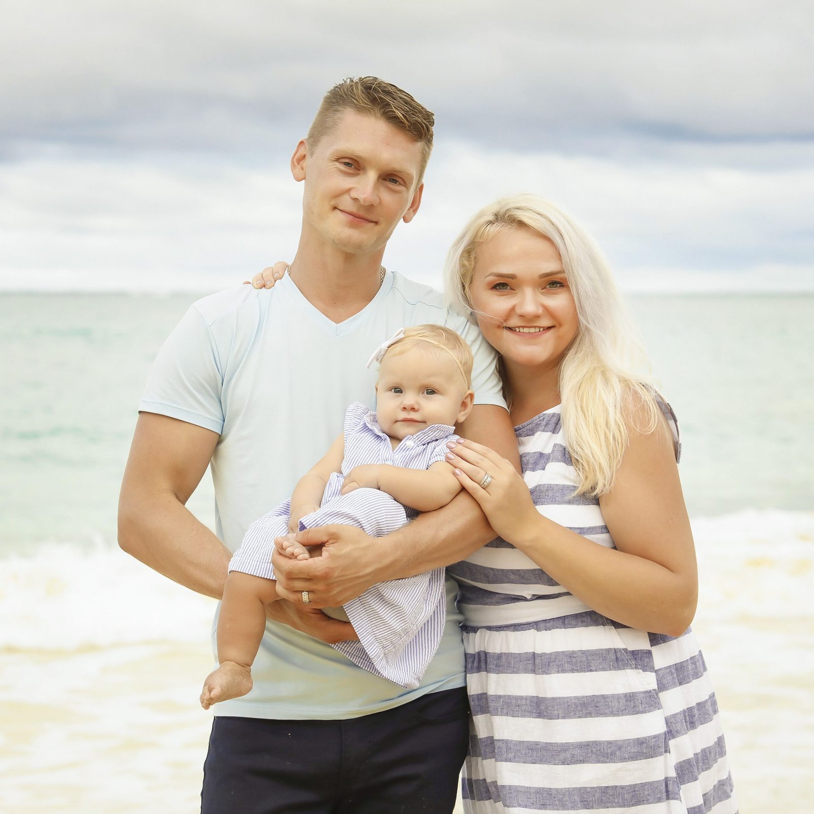 Family on the beach in Naples photo by Katrina Photography