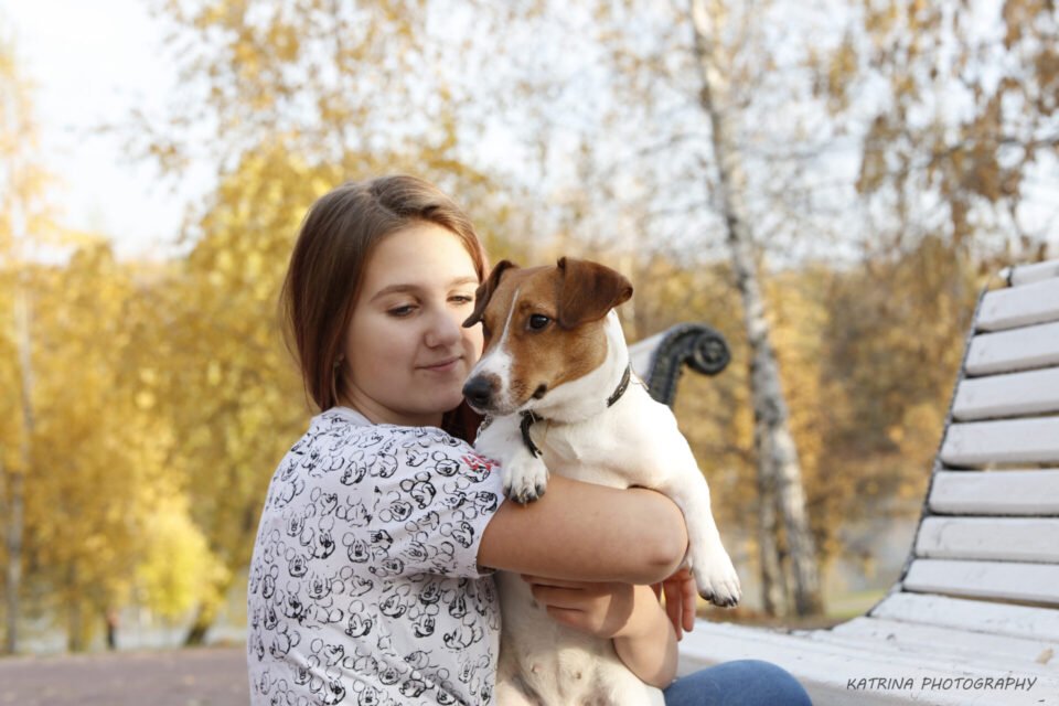 A photo of a girl and her dog by Katrina Photography