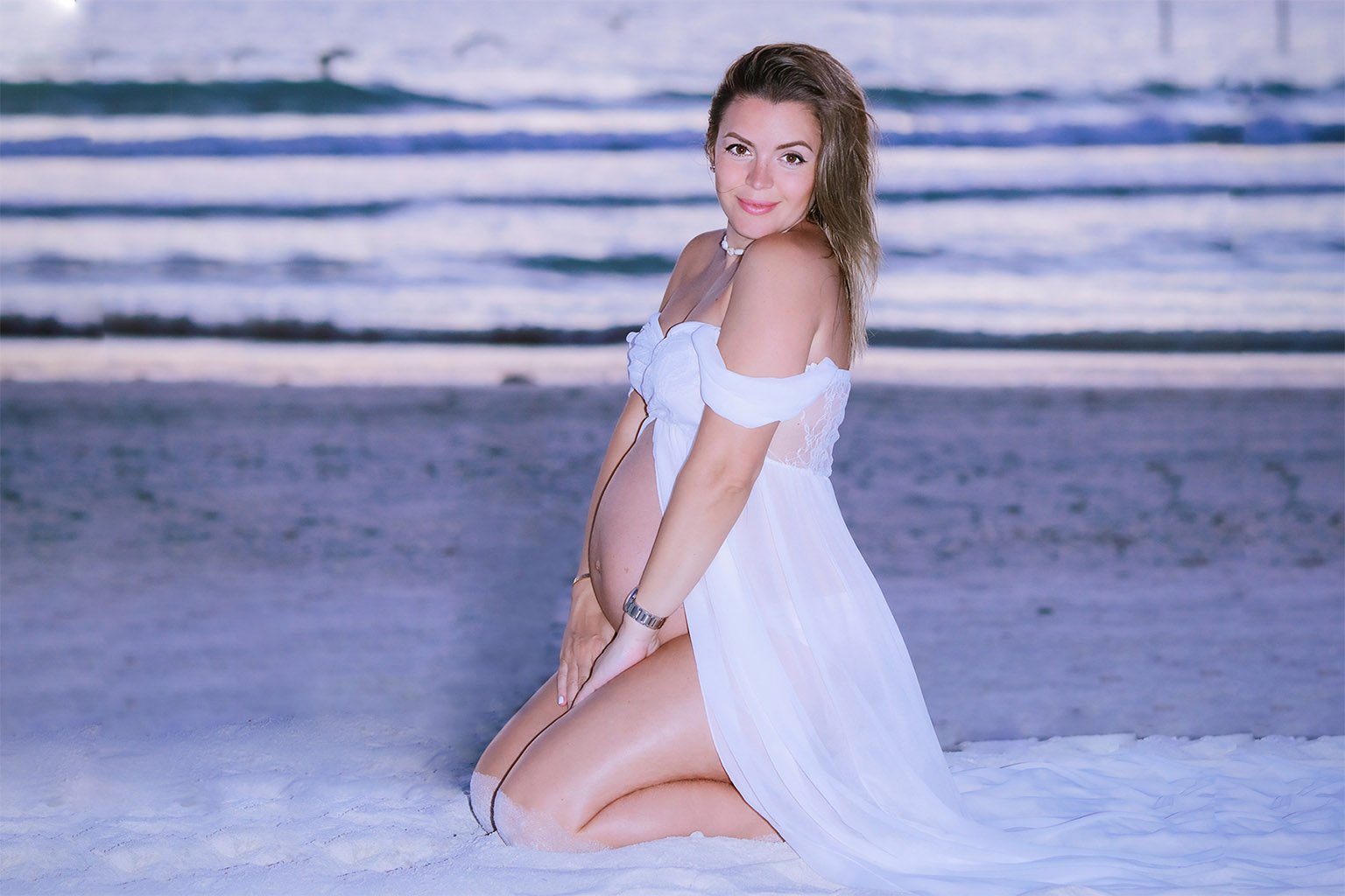 Photo of a mom-to-be on Naples beach by Katrina Photography